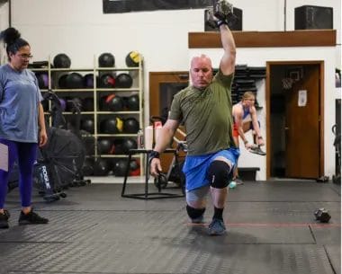 Man with dumbbell at CrossFit Rutherford